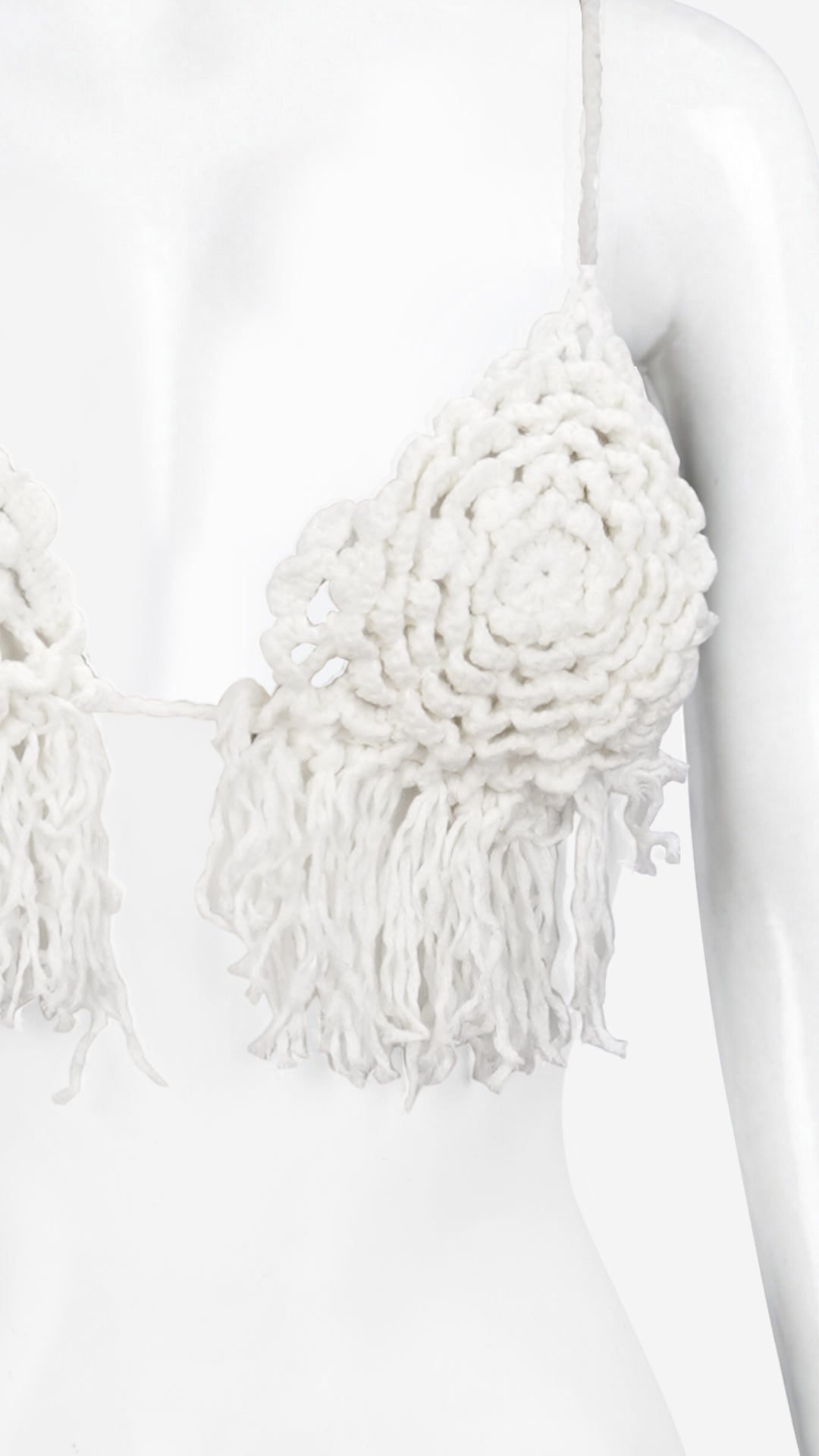 Close-up of white crochet triangle bralette floral knit detail