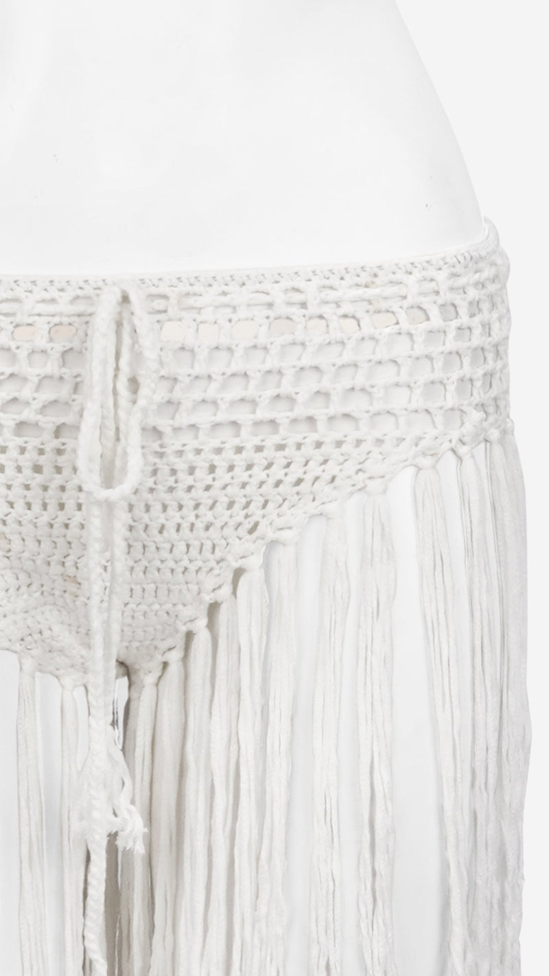 Close-up of white crochet fringe bottom waistband and tie detail