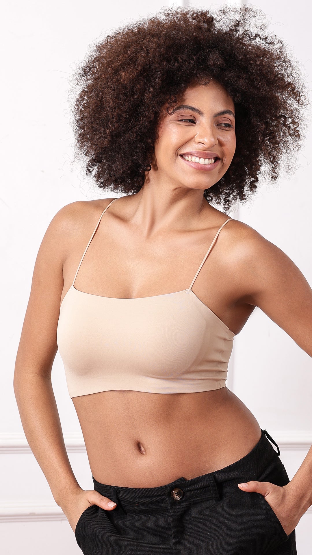 Beige Padded Cami Bralette worn with black pants, front view
