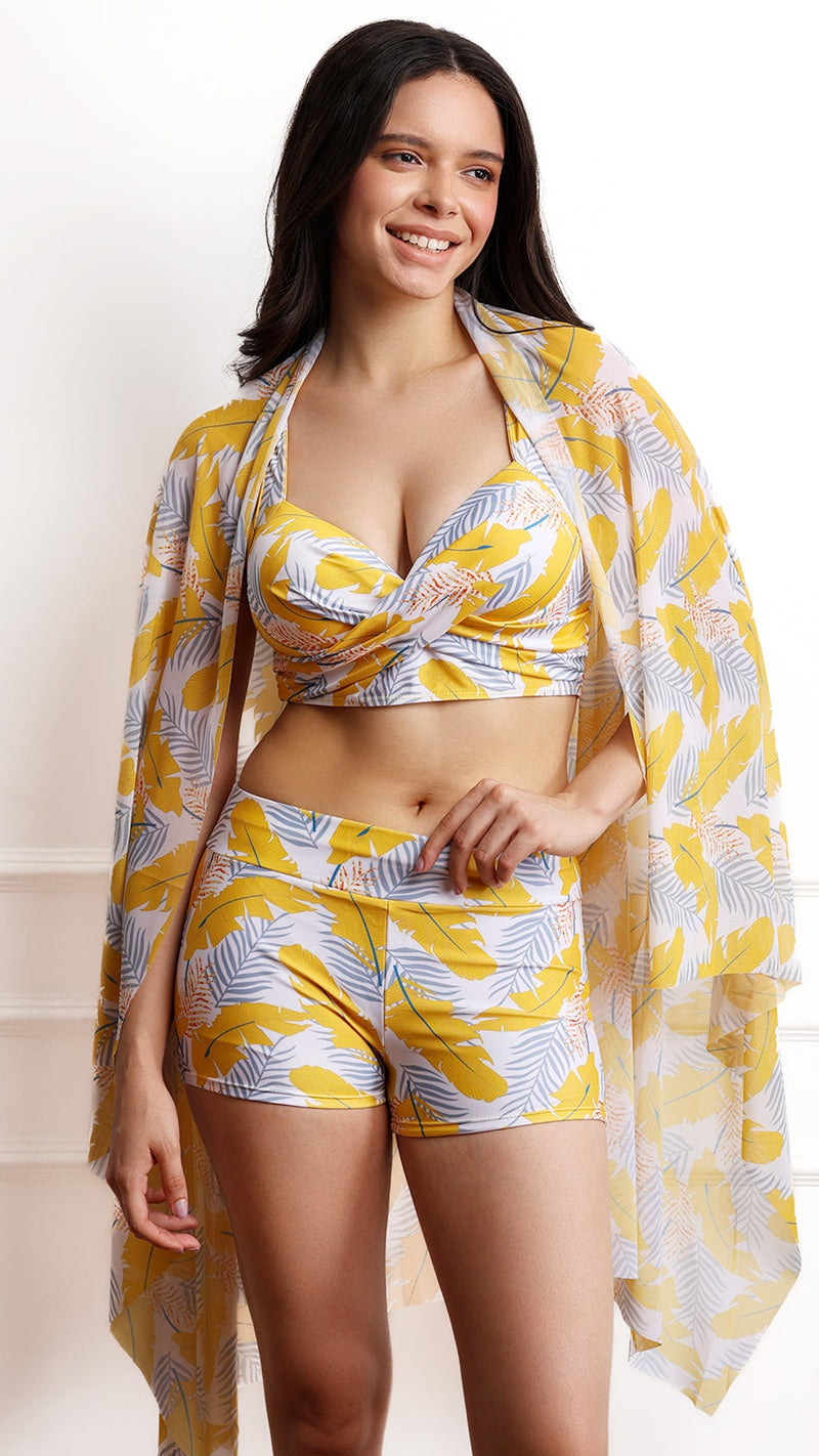 Woman wearing full tropical set with sarong draped over shoulders