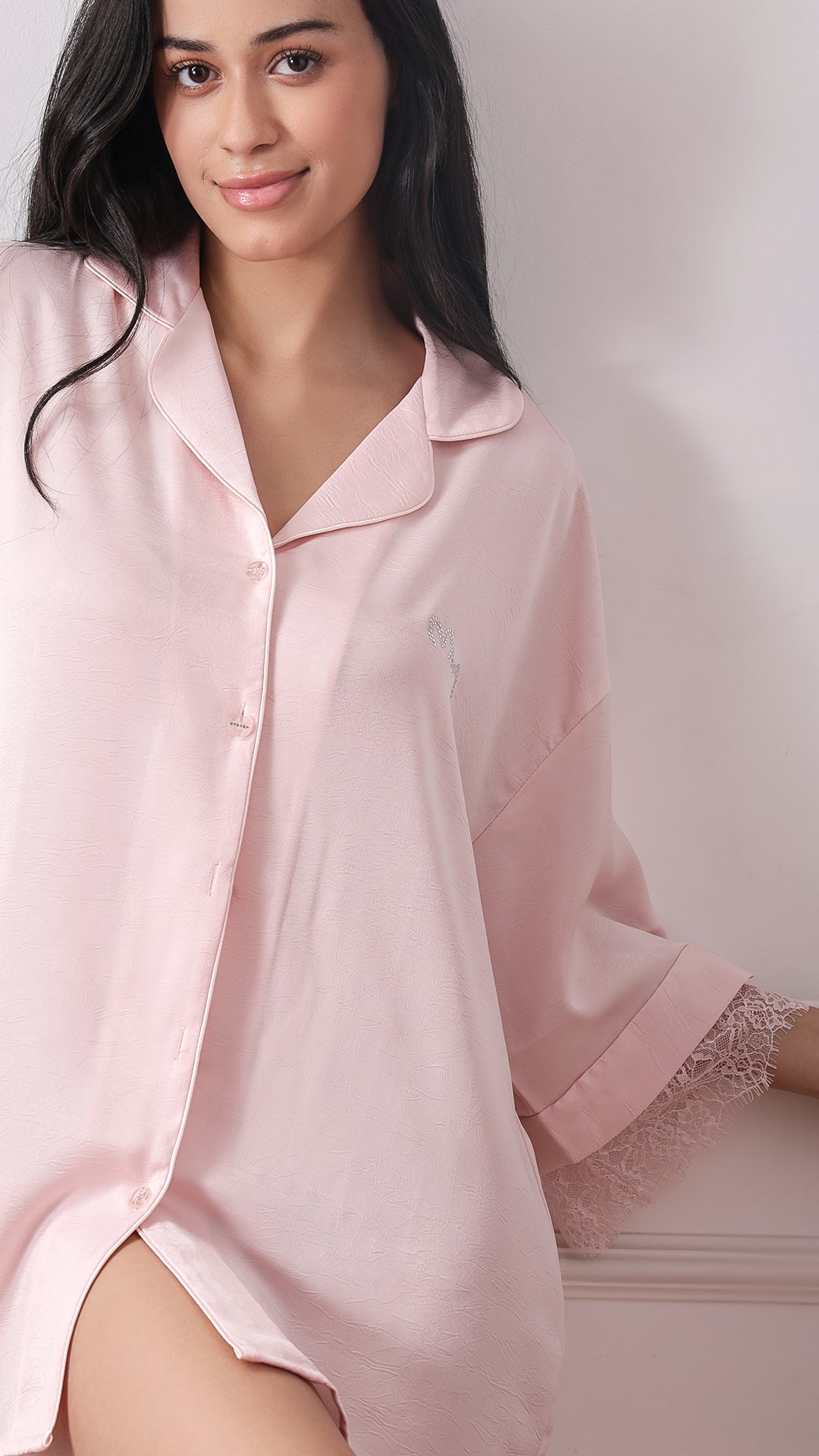 Pink satin button-down sleep shirt, close-up front view