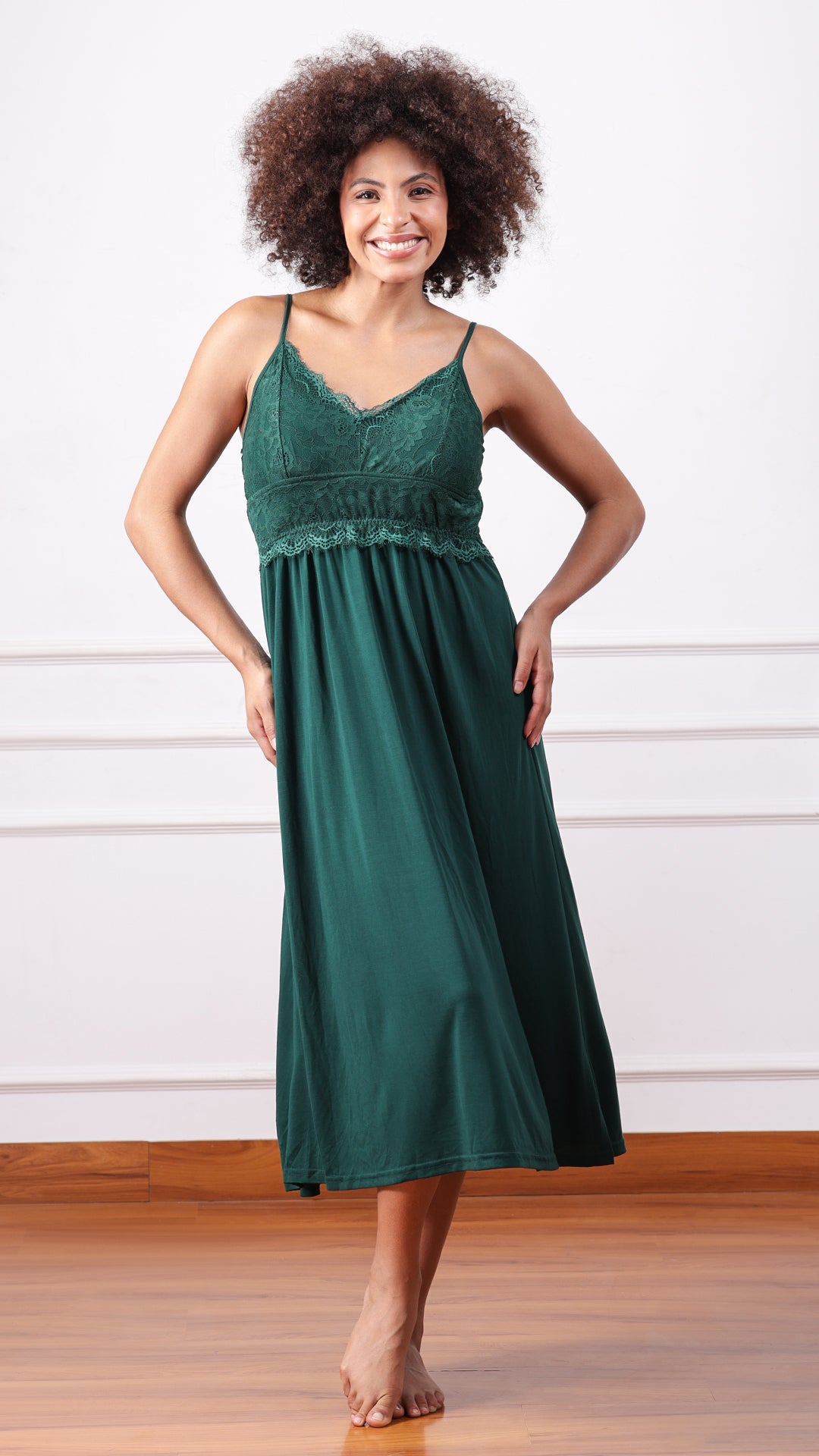 Woman wearing emerald green lace nightdress, front view