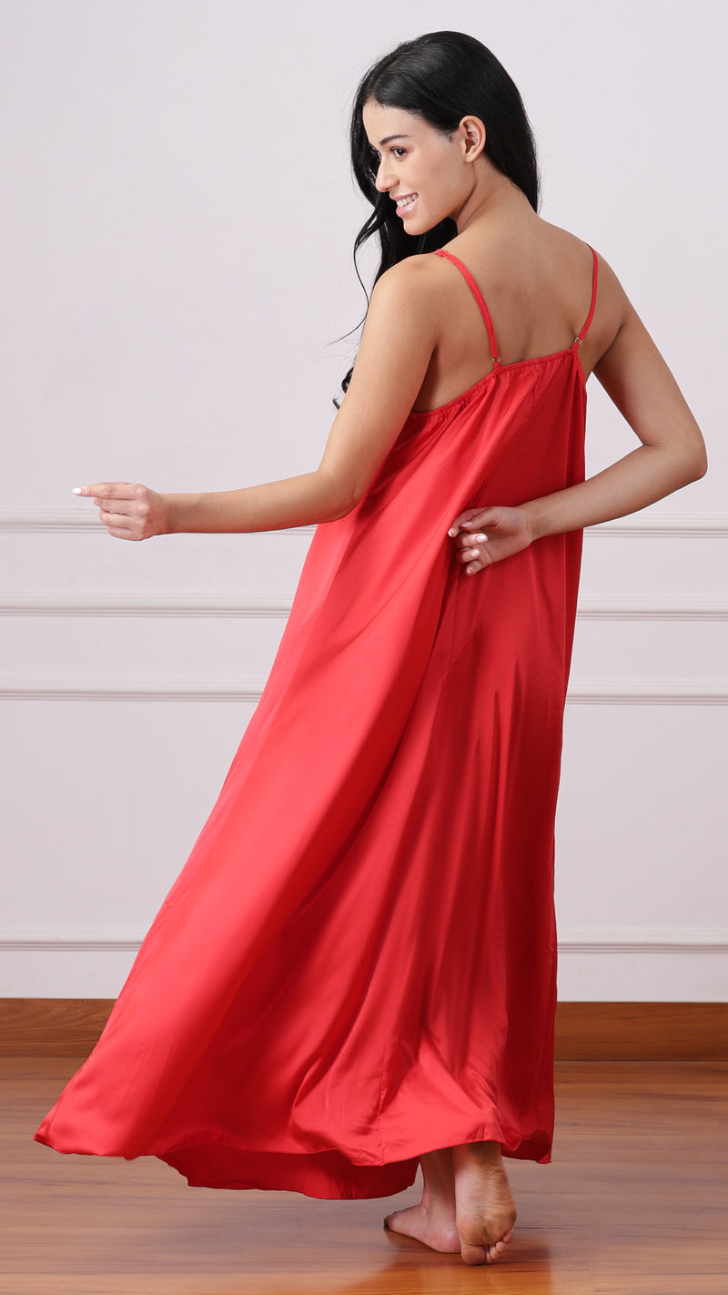 Close-up of woman in red satin nightgown with sheer lace robe