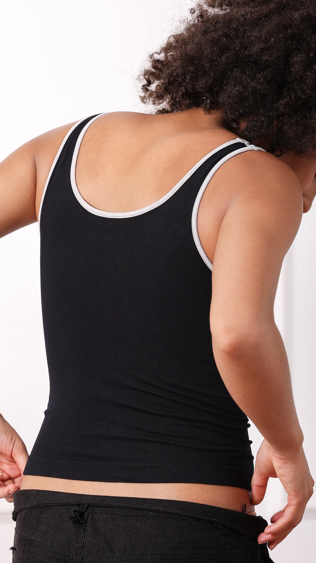 Back view of black contrast-trim tank top