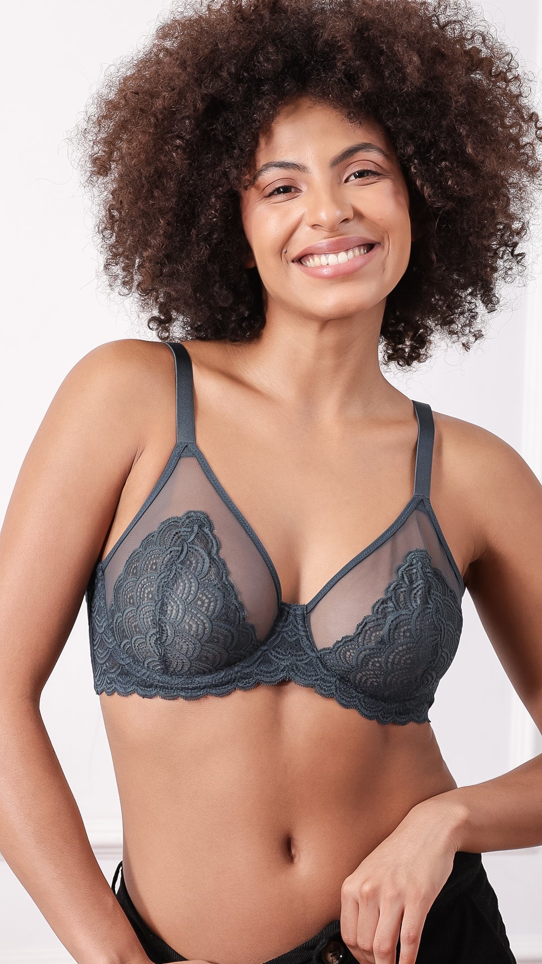 Model wearing grey sheer floral lace demi bra, front view