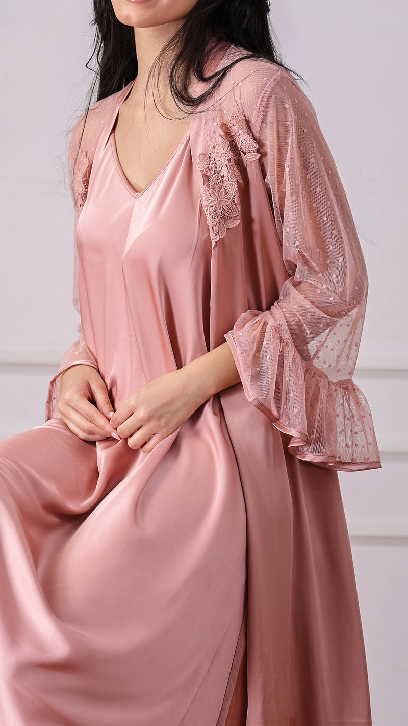 Close-up of dusty pink robe sleeve with floral lace applique