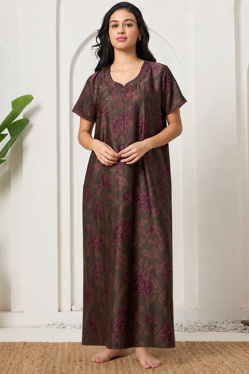 Woman standing in an olive and purple floral print nightgown