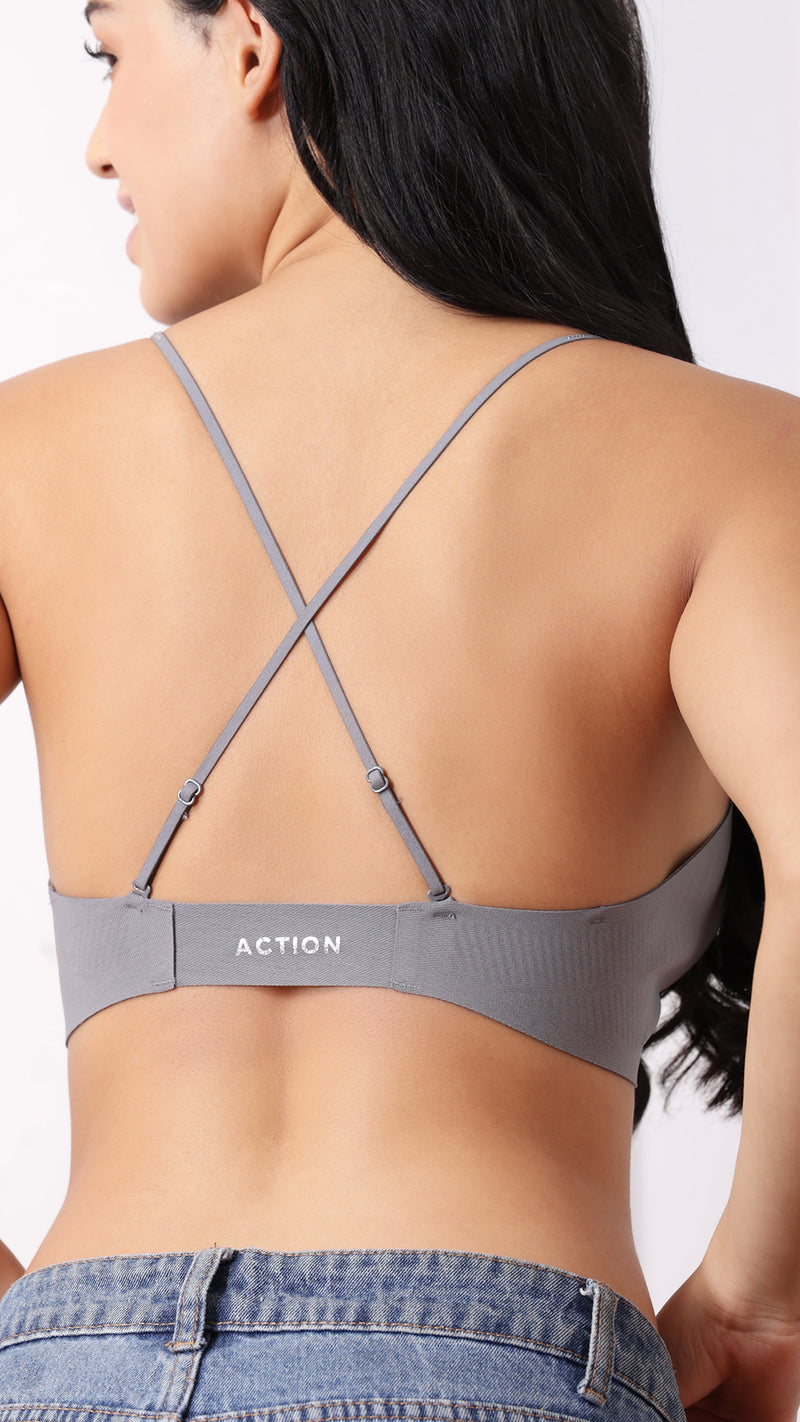 Back view of bralette showing criss-cross straps and branding
