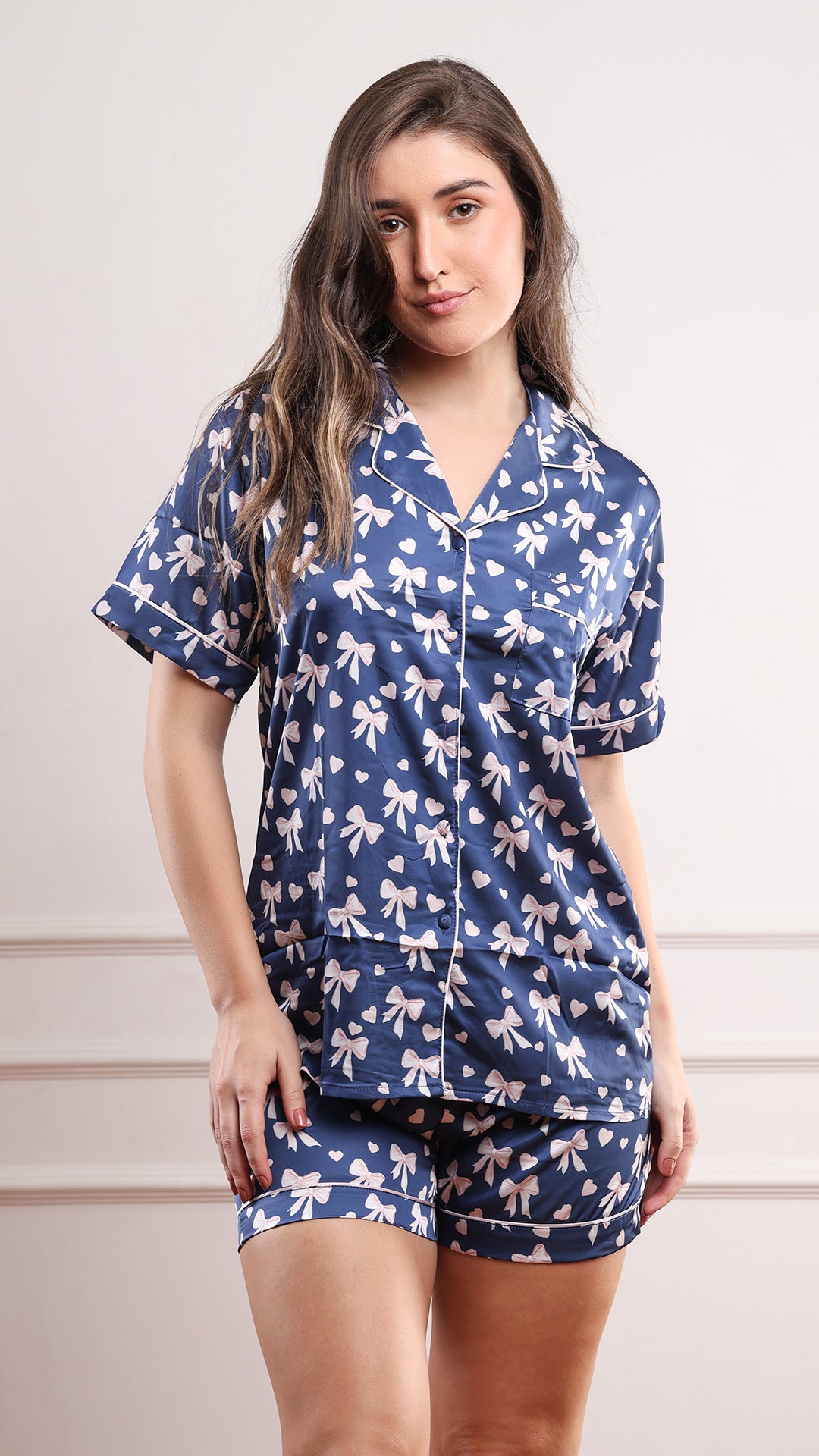 Women's navy satin bow print pajama set with button-down shirt and matching shorts