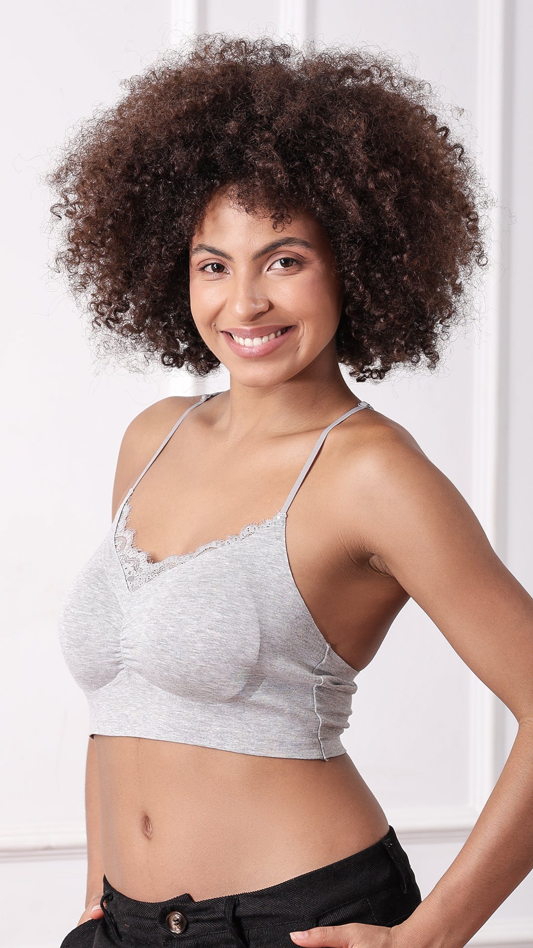 Side view of woman wearing grey racerback bralette