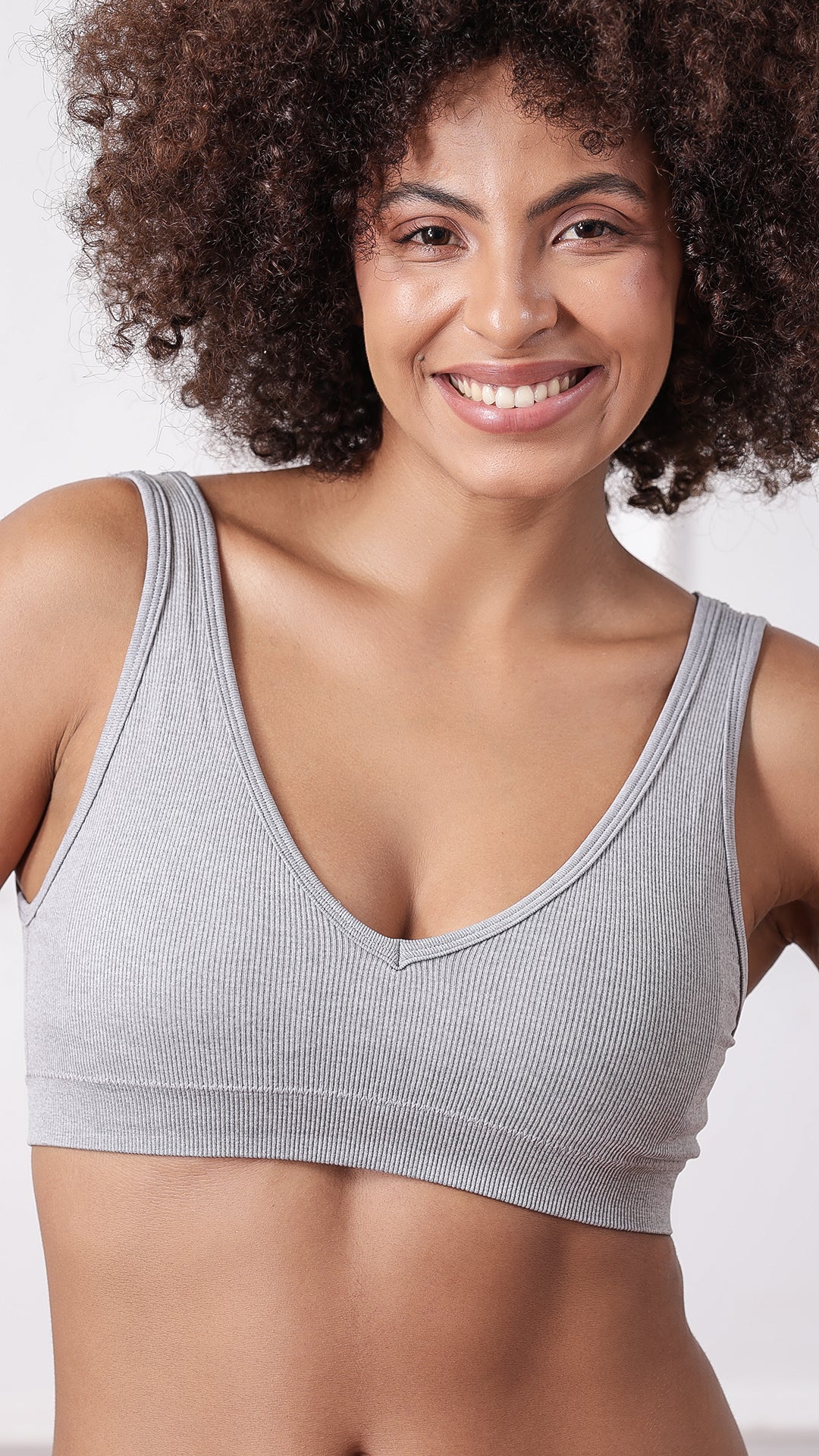 Close-up of beige ribbed V-neck wireless bra plunge detail