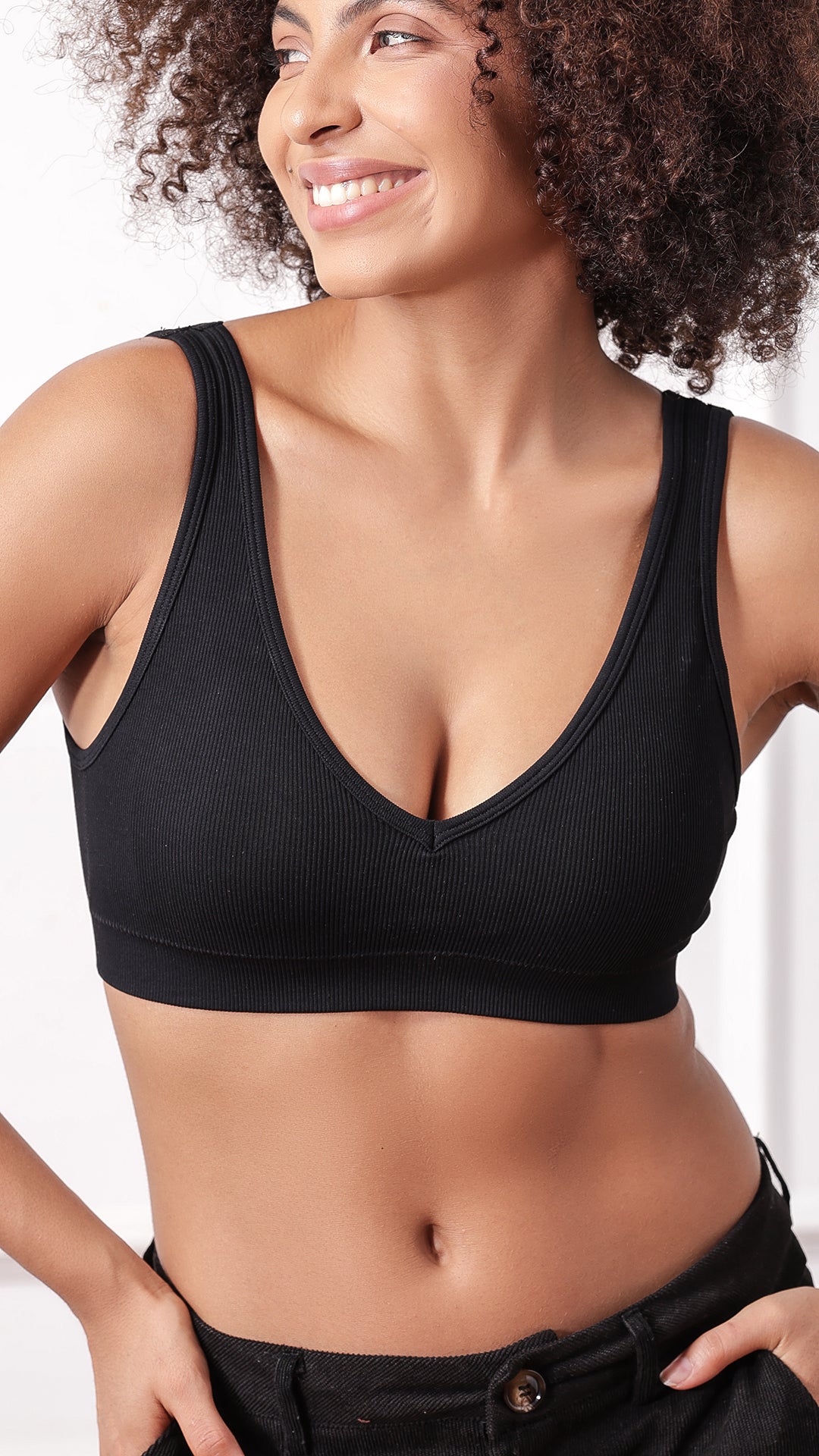 Close-up of black V-neck bra neckline and straps