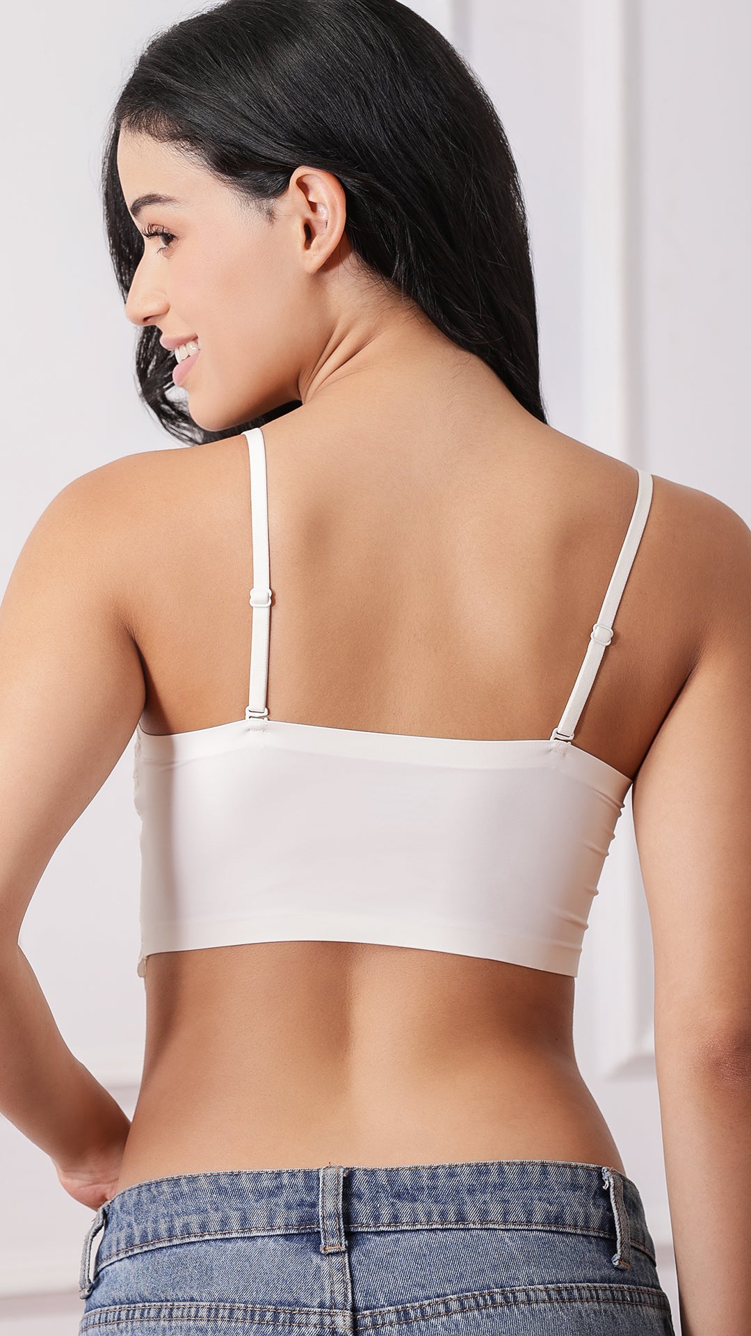 Back view of lace corset bra showing smooth seamless band