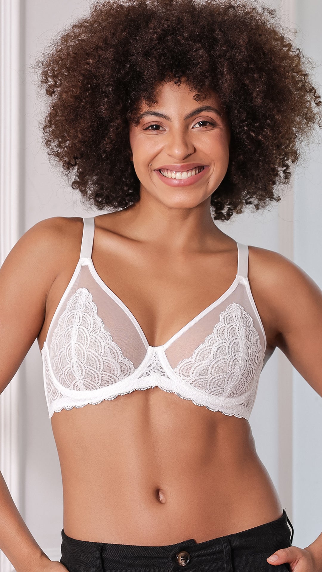 Model wearing white sheer floral lace demi bra, front view