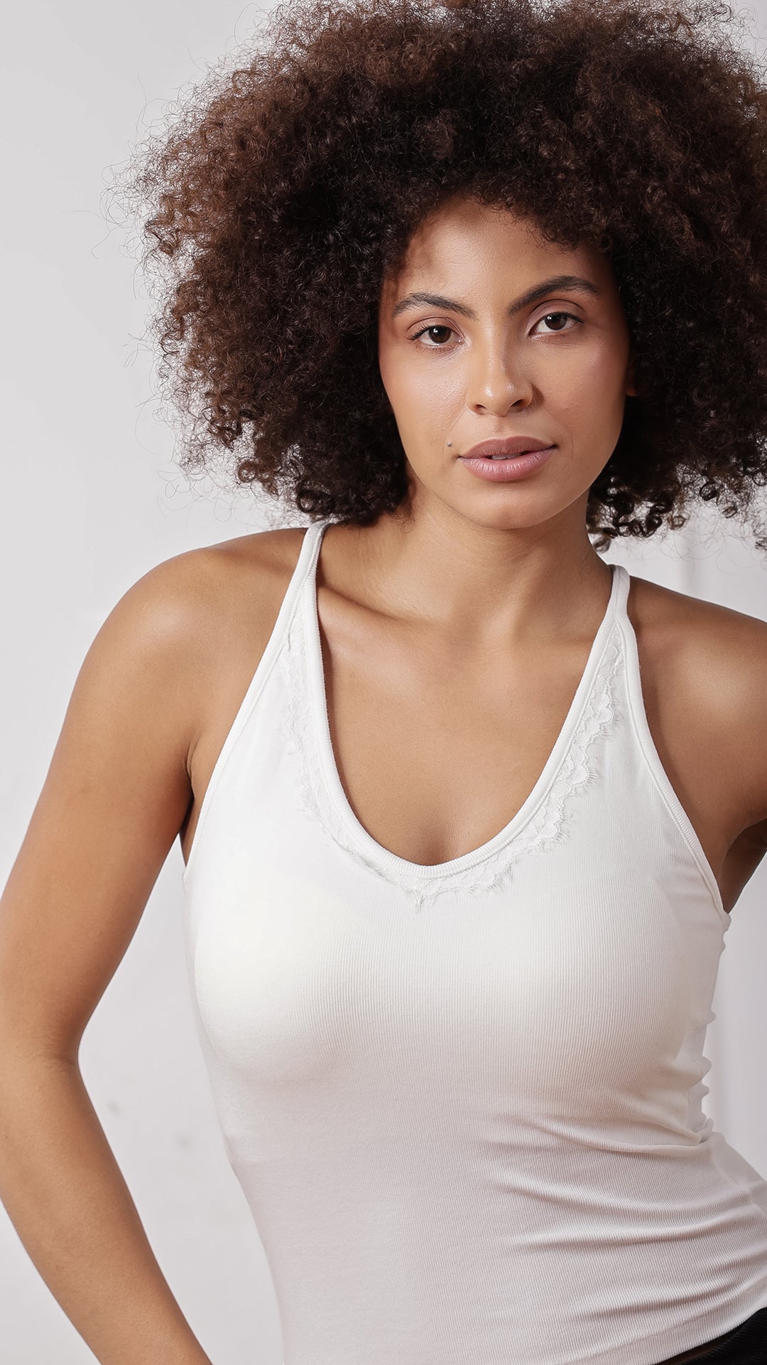 Close-up of white racerback tank top, front view