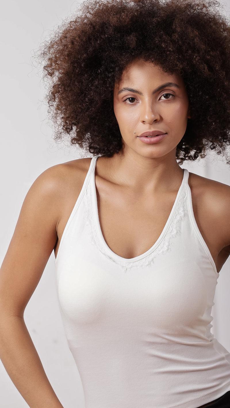 Close-up of white racerback tank top, front view