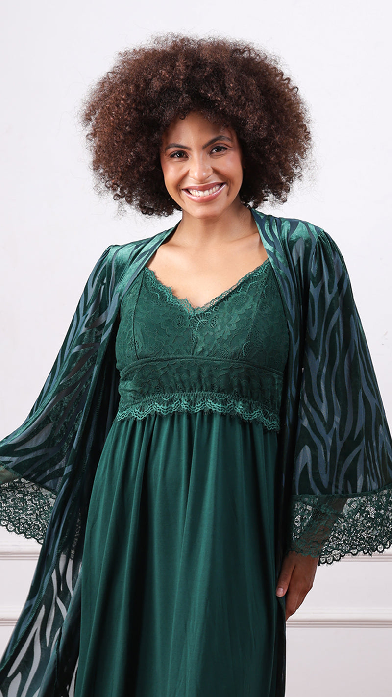 Woman wearing emerald green nightdress with zebra-print robe