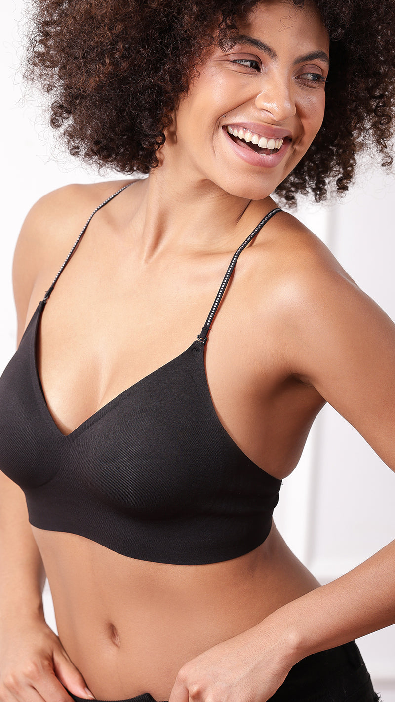 Close-up of black bralette V-neckline and strap detail