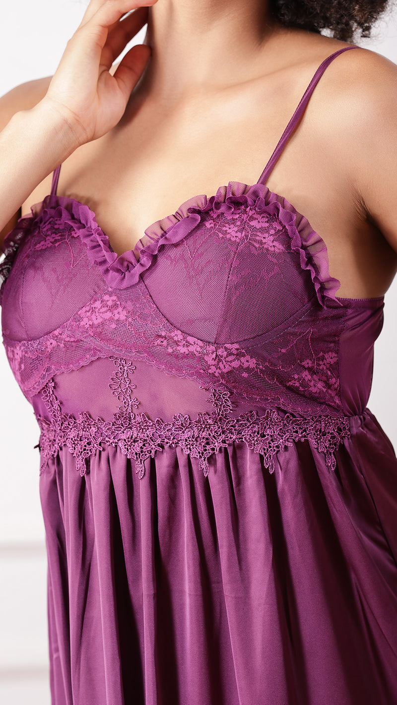 Close-up of purple lace bodice and ruffle trim detail