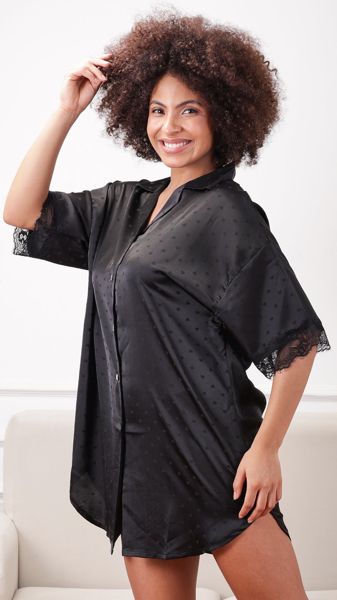 Black satin sleep shirt with lace trim, close-up front view