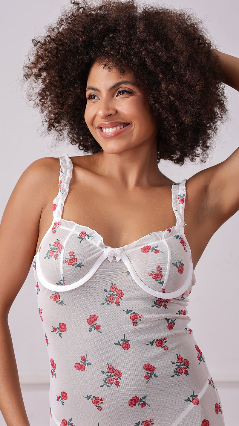 Close-up of woman in white floral mesh underwire dress