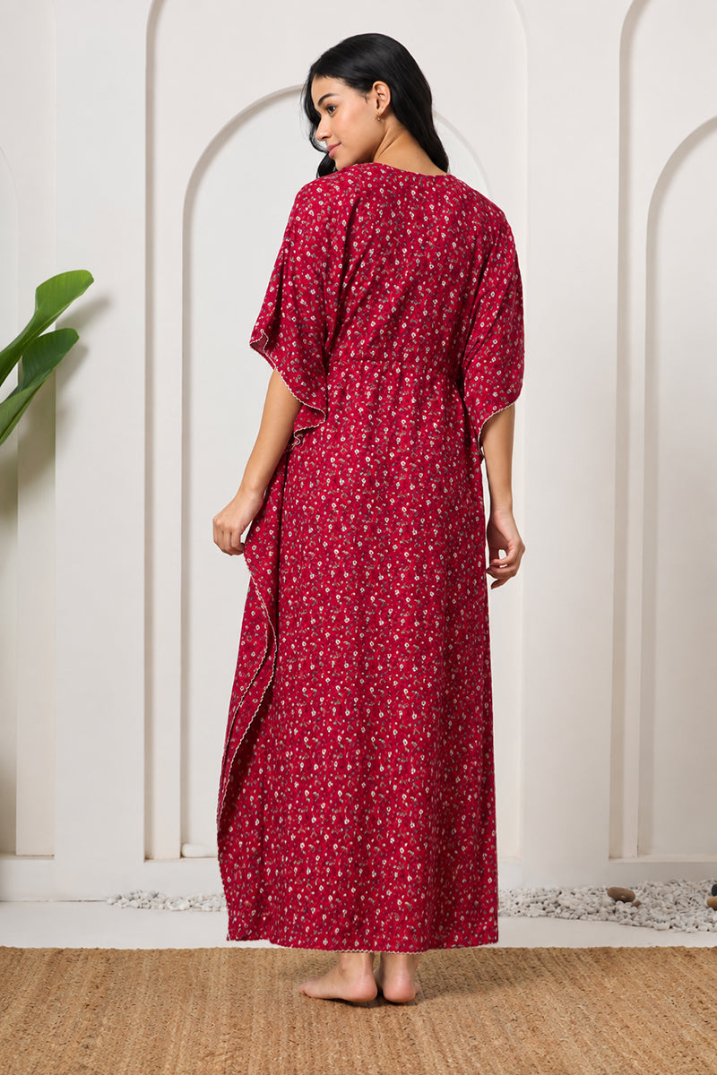 Back view of a woman wearing a red ditsy floral kaftan