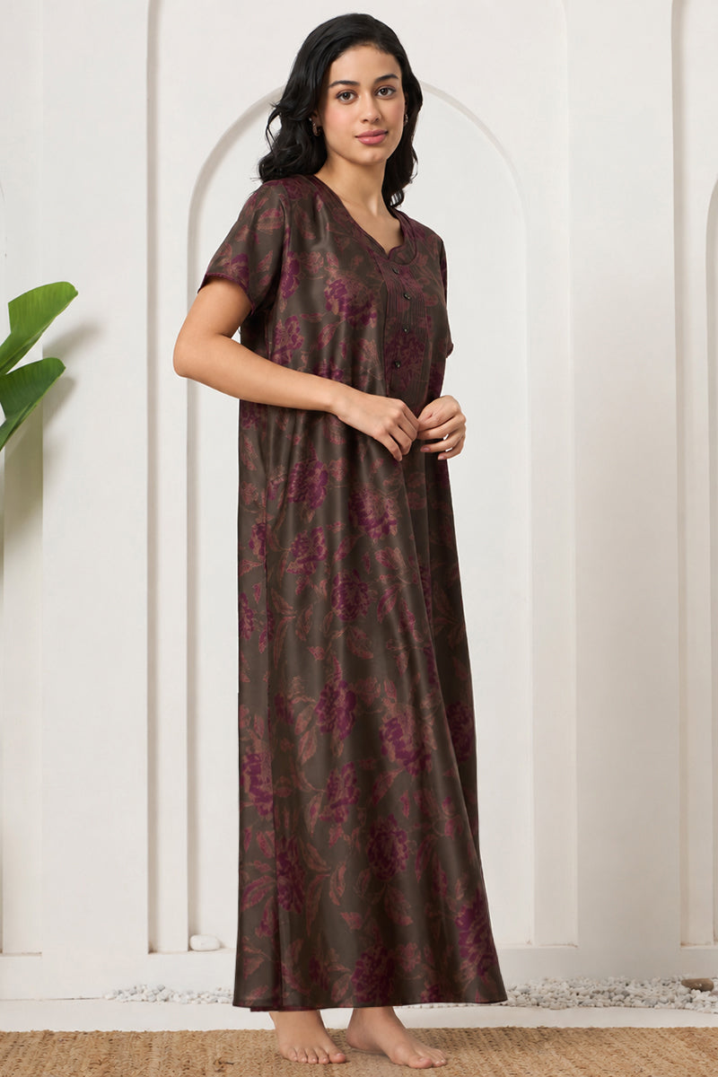 Woman posing sideways in an olive floral nightgown