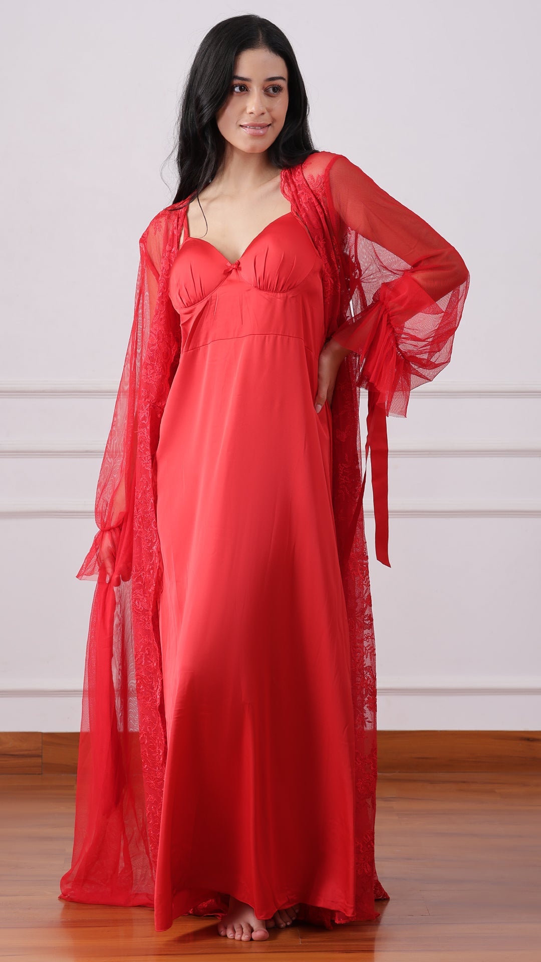 Woman wearing red satin nightgown with sheer floral lace robe