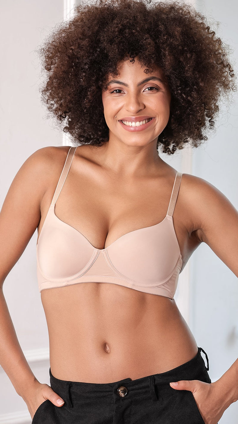 Model wearing beige non-wired deep plunge bra, front view