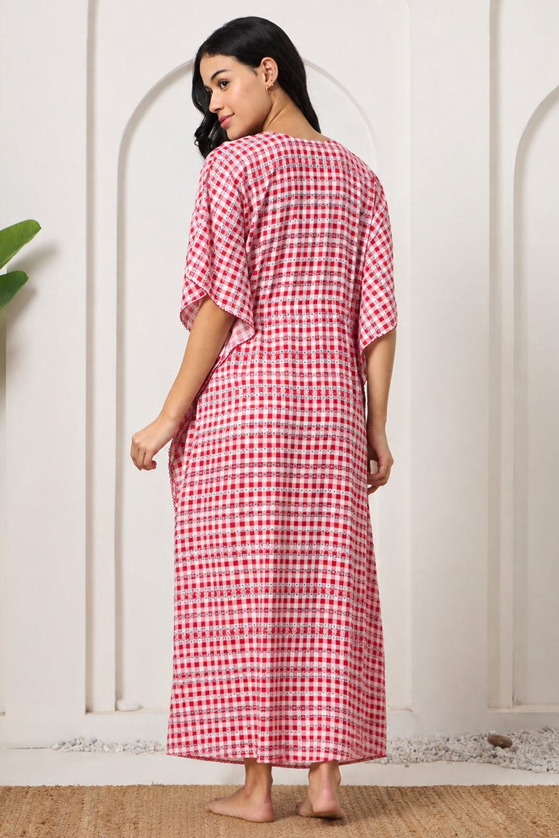 Back view of a woman in a red check kaftan