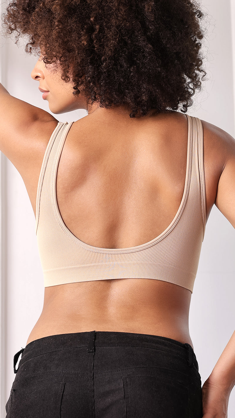 Back view of beige ribbed bra showing deep scoop back and straps