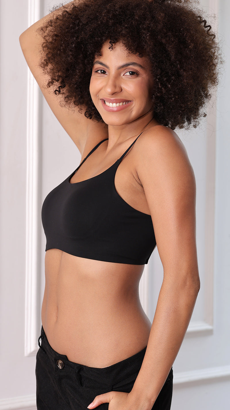 Side view of model wearing black seamless cami bralette