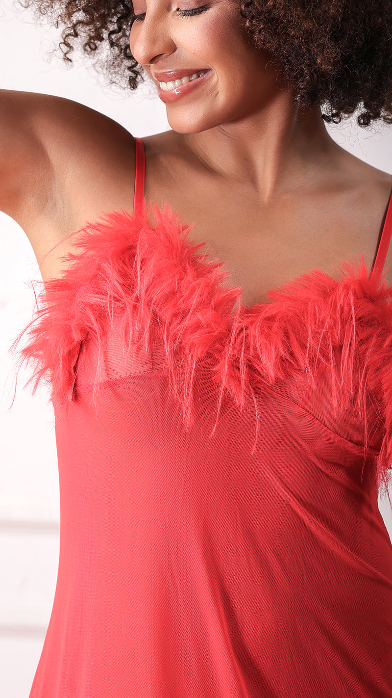 Close-up of red feather trim on sheer mesh slip dress neckline