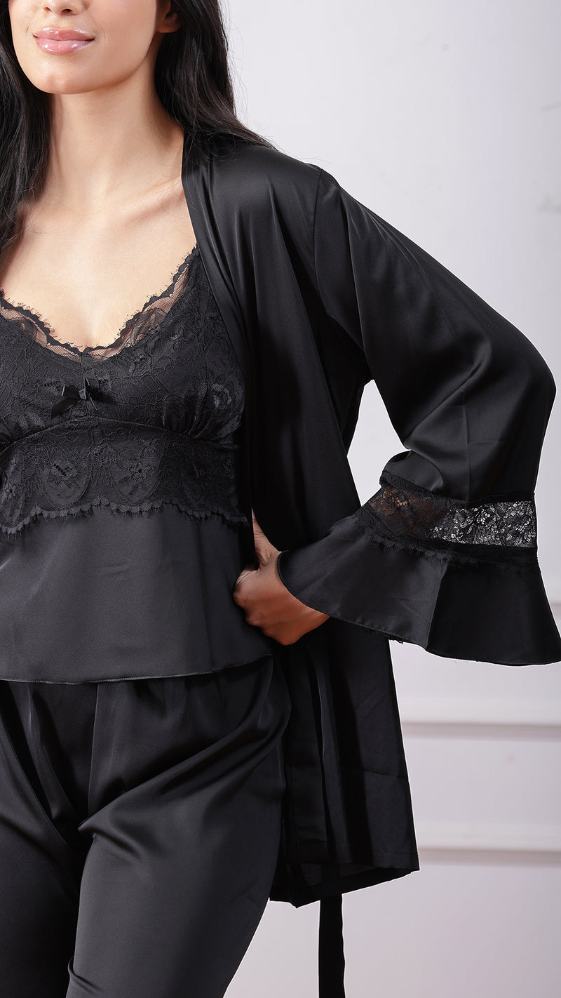Close-up of black satin robe with lace cuff and camisole detail