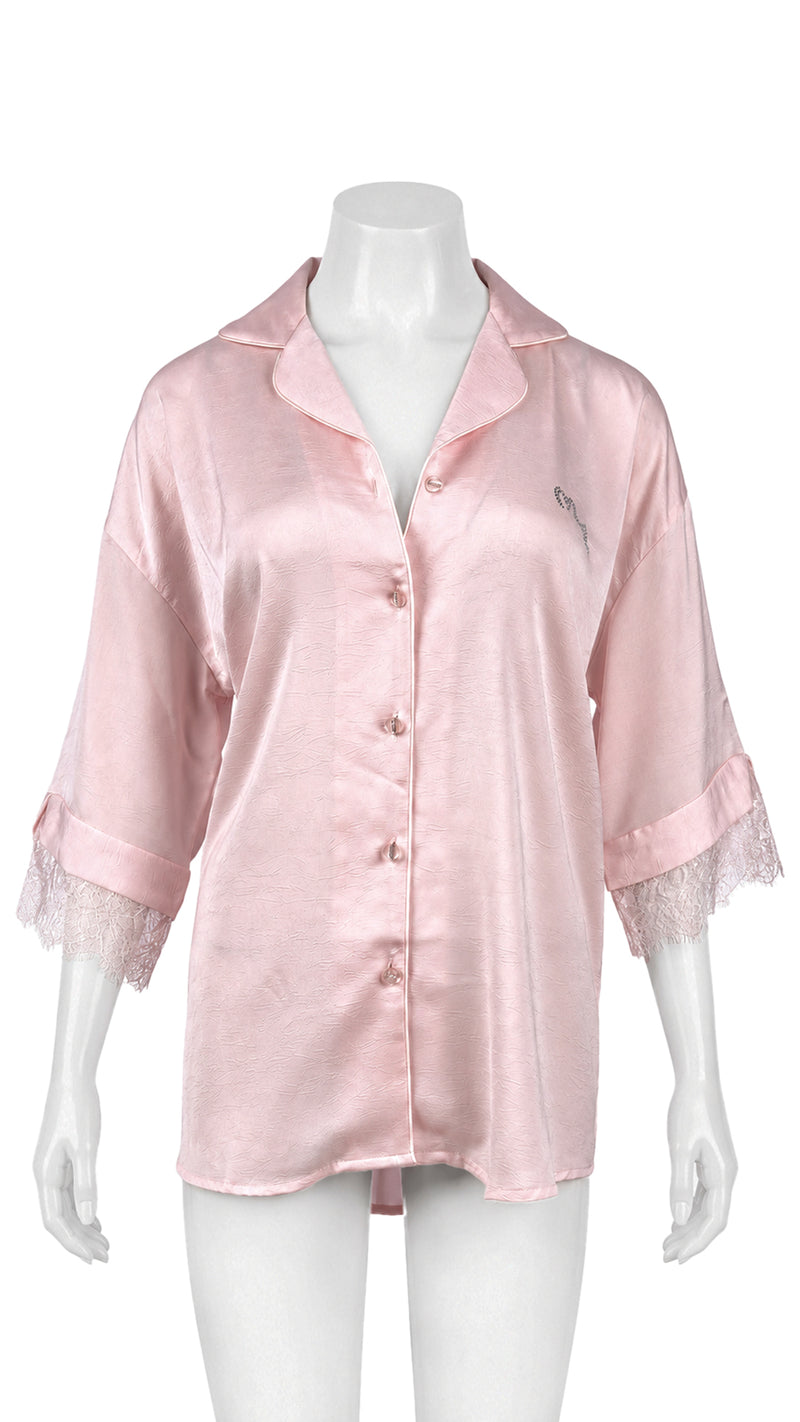 Pink satin sleep shirt with lace trim on mannequin, front view