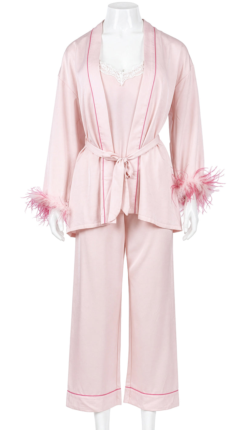 Mannequin display of pink satin feather-cuff robe and pajama set