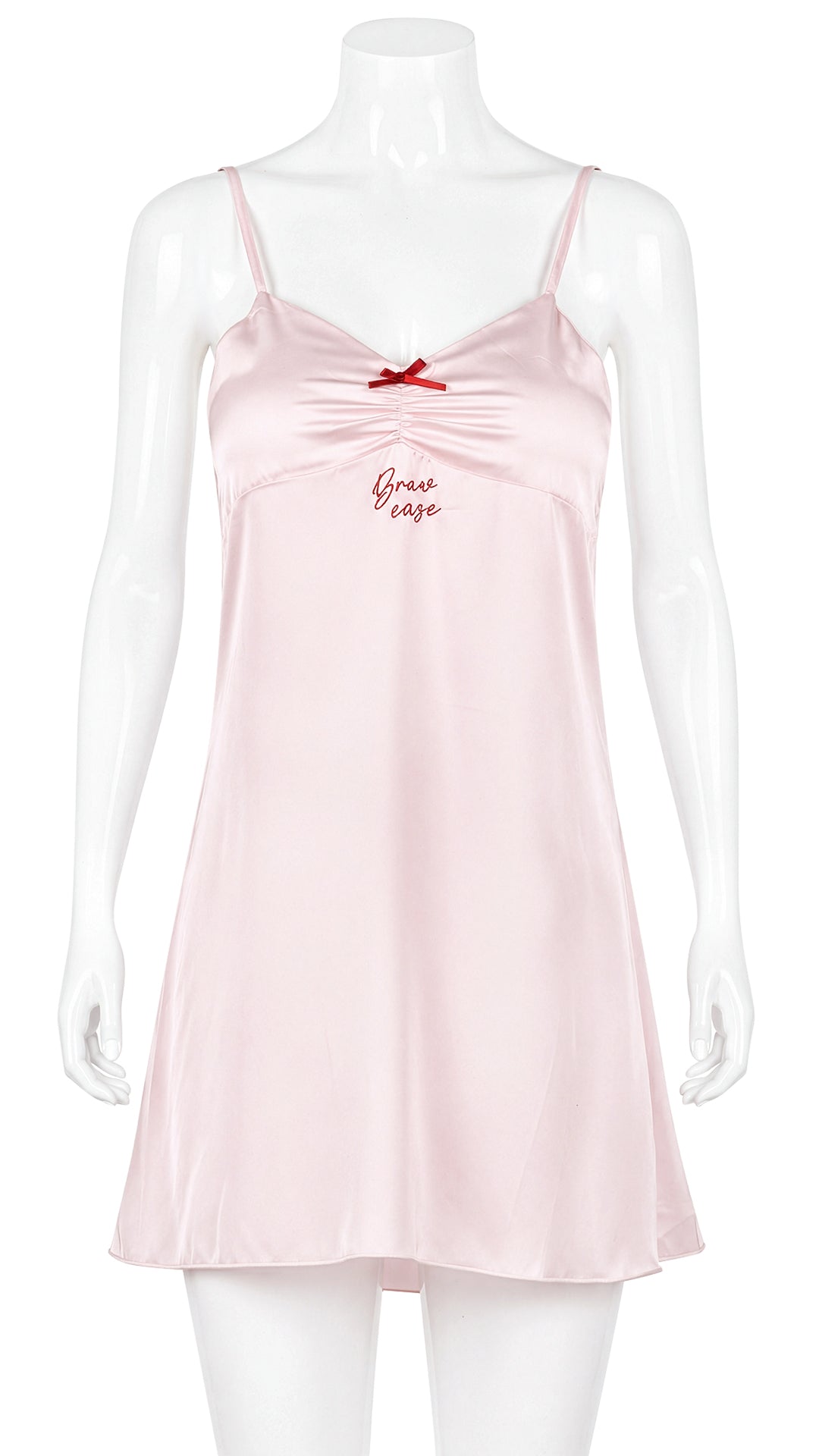 Mannequin display of pink satin chemise with red bow detail