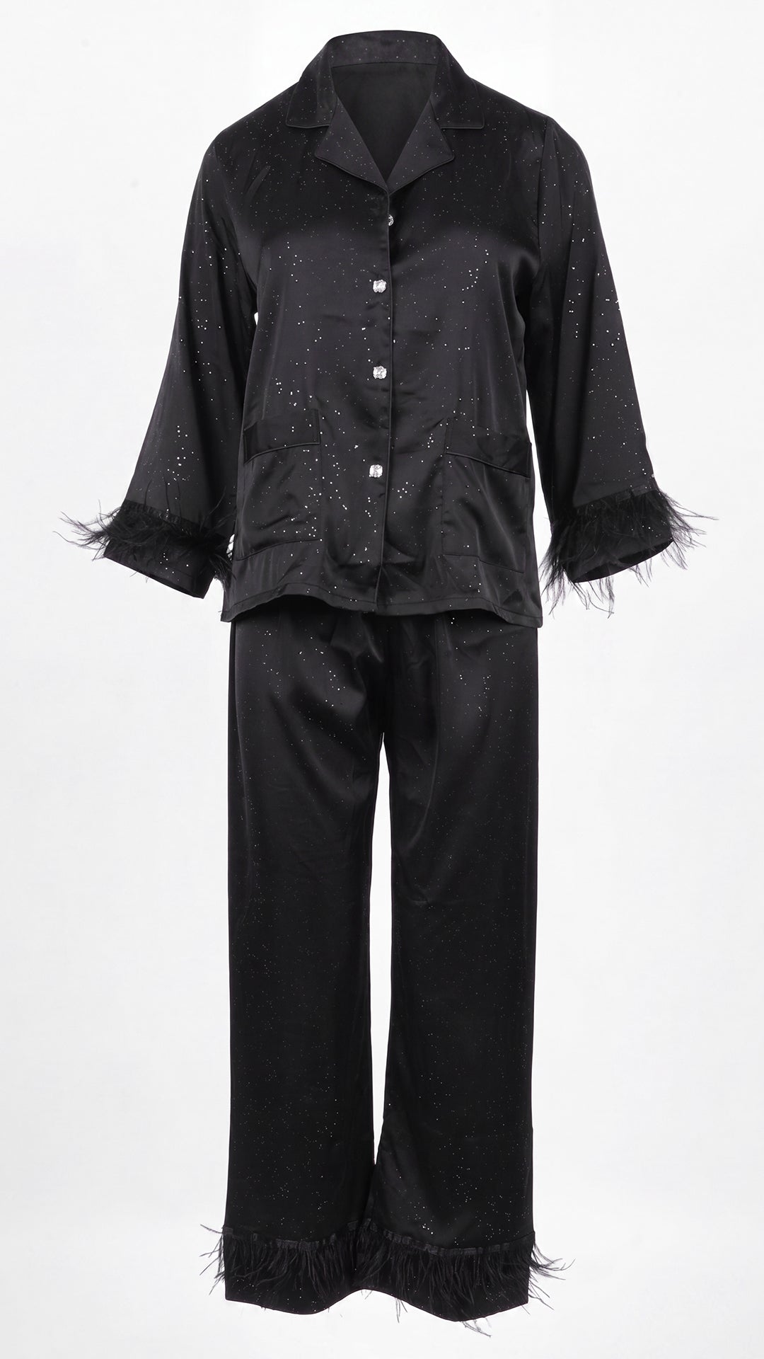 Front view of black glitter satin pyjama set on white background