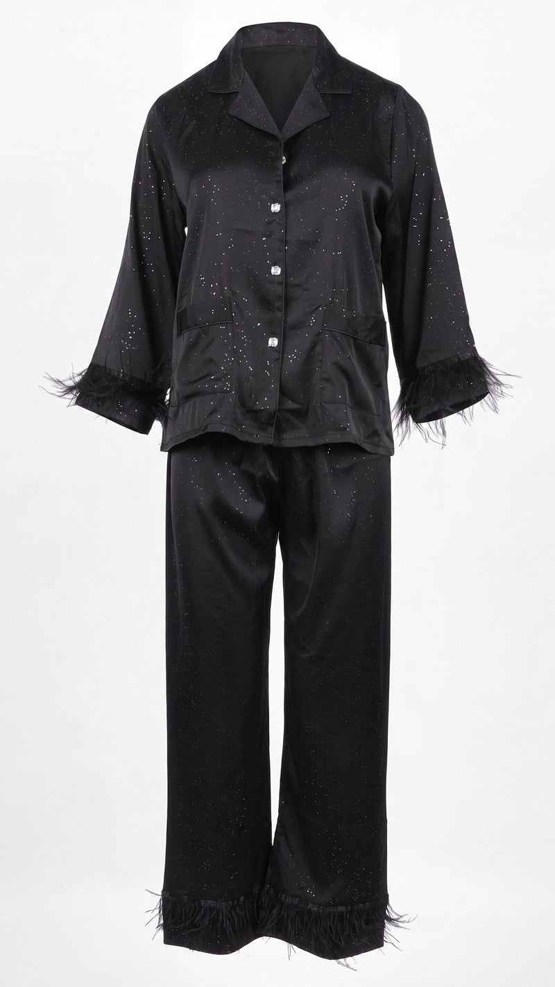 Front view of black glitter satin pyjama set on white background