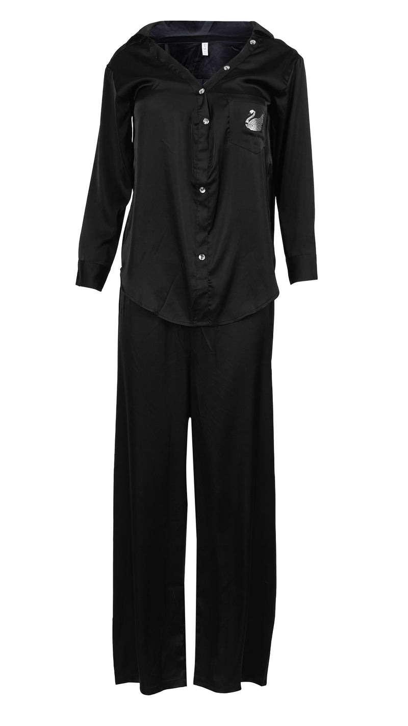 Front view of black satin pyjama set on white background