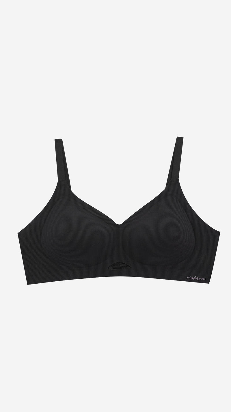 Black wireless full coverage bra on white background, front flat lay