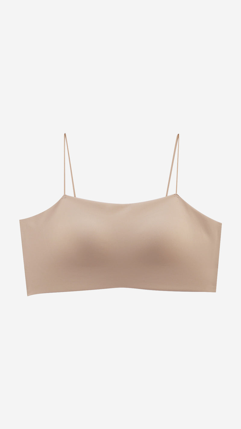 Beige seamless bandeau bralette on white background, front flat lay
