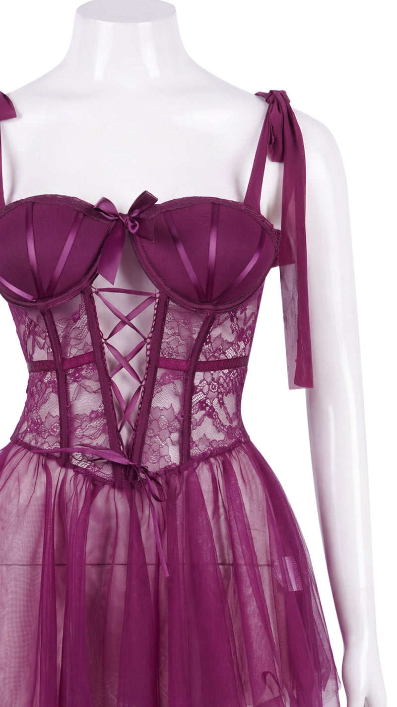 Close-up of purple corset bodice and lace-up detail on mannequin