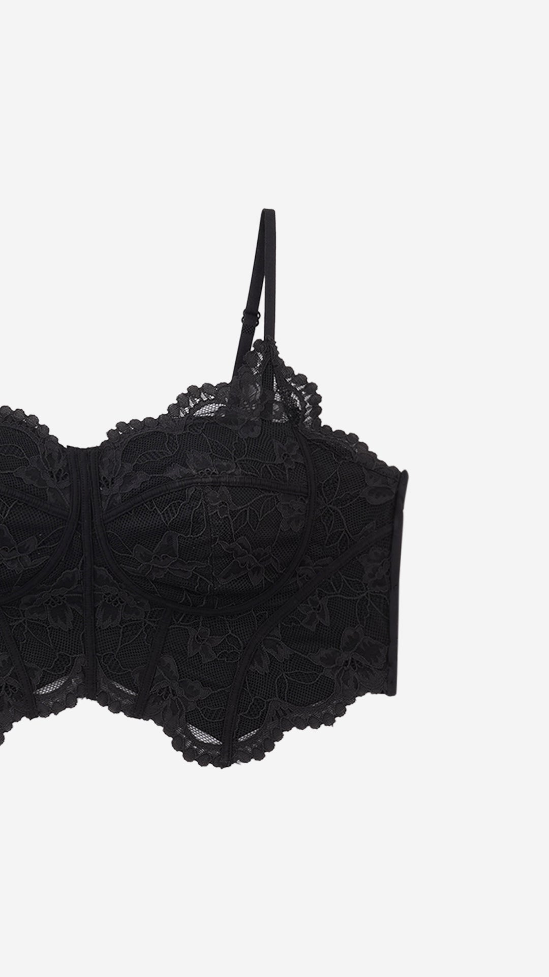Close-up product shot of lace corset bra cup and strap detail