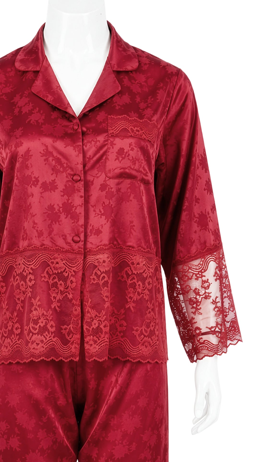 Close-up of red satin jacquard pyjama shirt with lace trim on mannequin