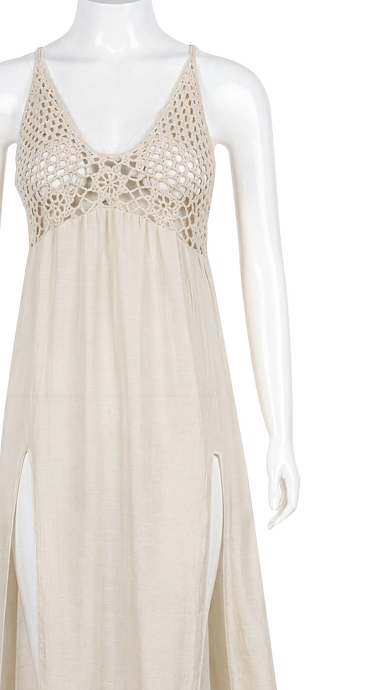Close-up product shot of beige maxi dress bodice and slit detail