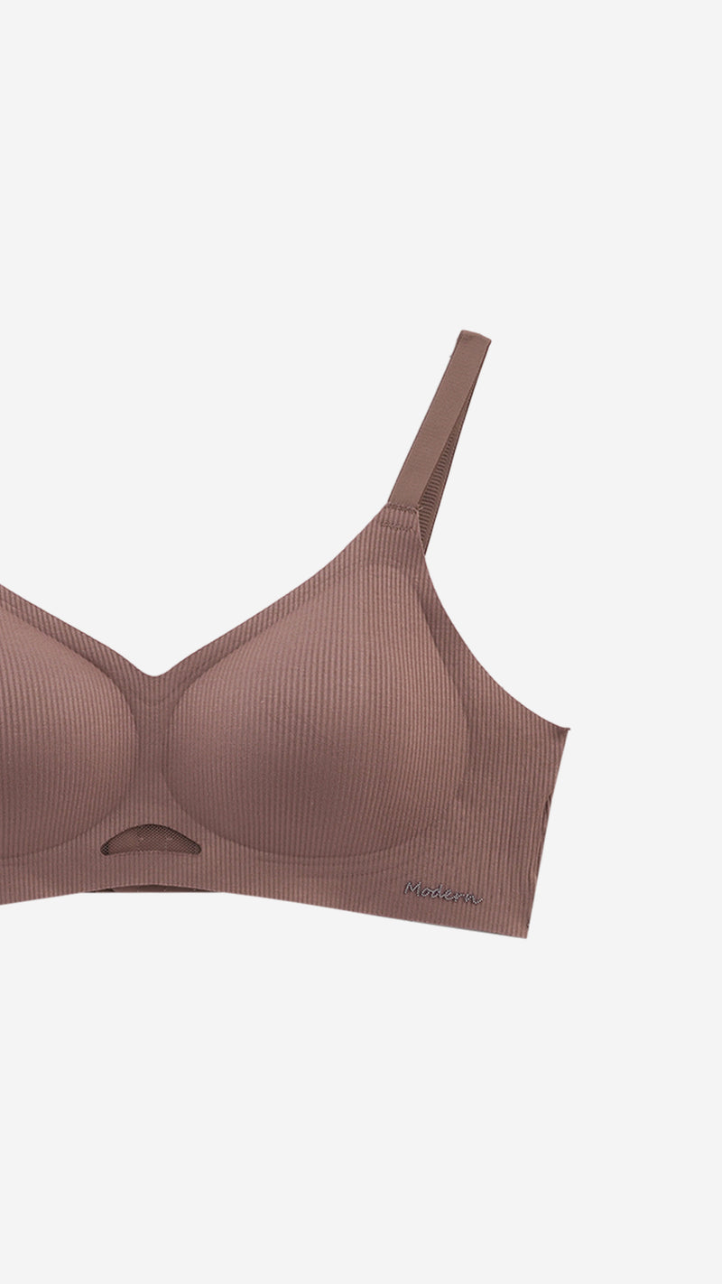 Close-up product shot of padded bra strap and cup detail