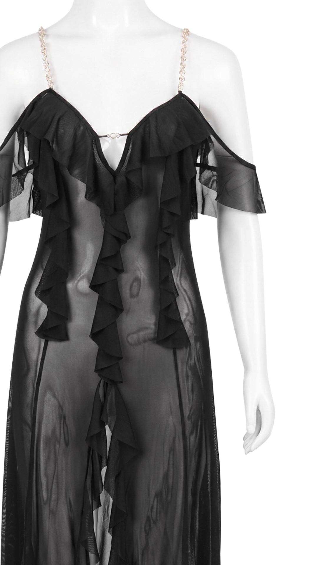Close-up product shot of black sheer gown chain straps and ruffle back