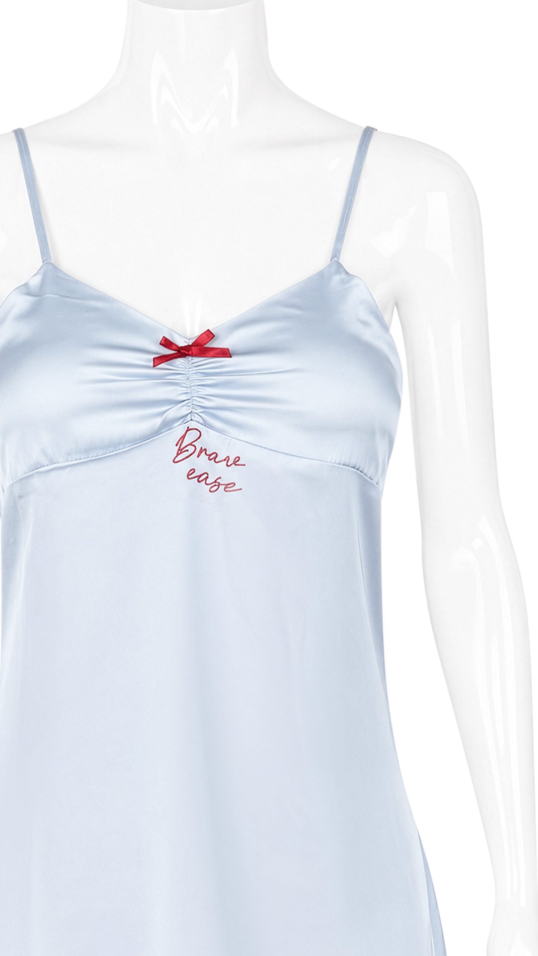 Close-up of pale blue satin chemise neckline on mannequin