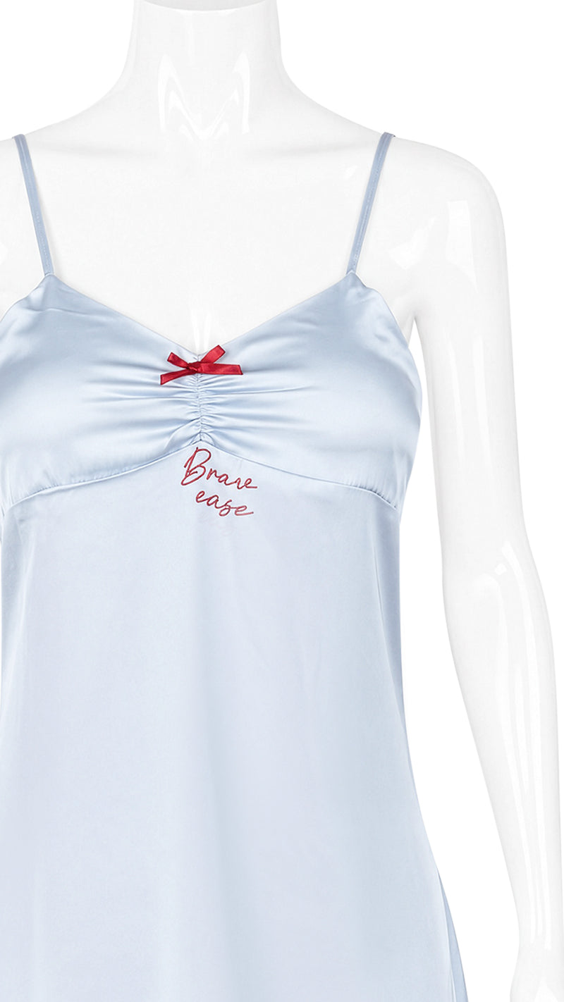 Close-up of pale blue satin chemise neckline on mannequin